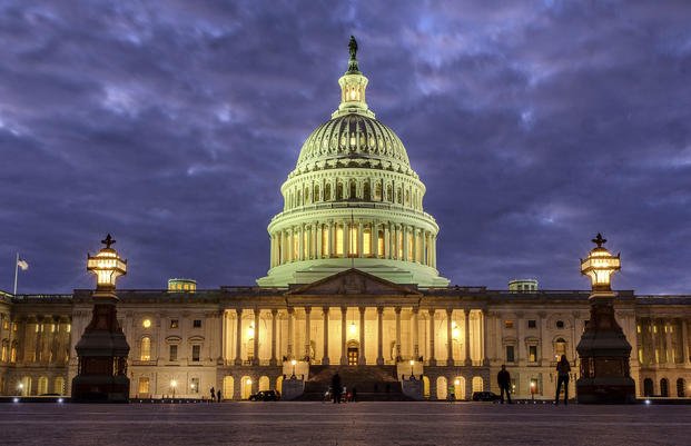 Lights shine inside the U.S. Capitol Building