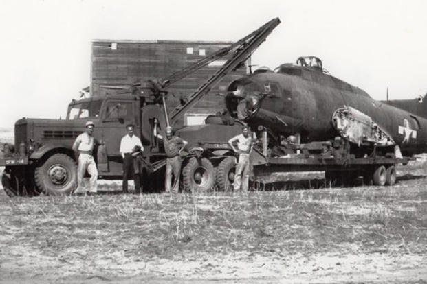 Towing a mangled B-17 is a big job; fortunately, the Federal 606 wrecker is a big truck. 