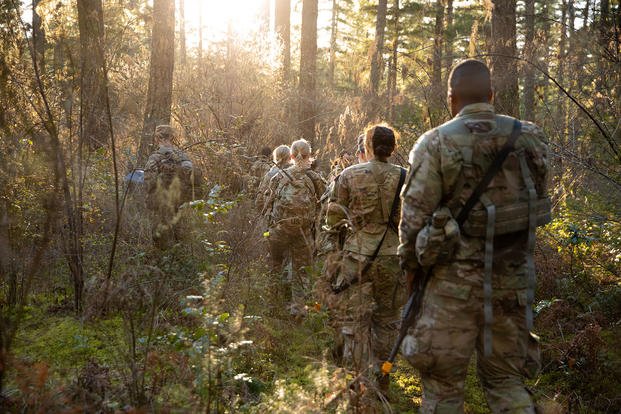 U.S. Army Reserve Officer Training Corps cadets patrol the forest at Joint Base Lewis-McChord