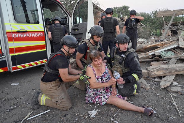 Woman faints following an airstrike in the town of Bilopillya, Ukraine