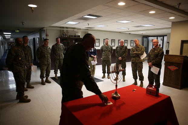 Capt. Irving Elson, a chaplain with I Marine Expeditionary Force, prepares the menorah lighting for Hanukkah at the 3rd Marine Aircraft Wing Headquarters building aboard Marine Corps Air Station Miramar, Calif.