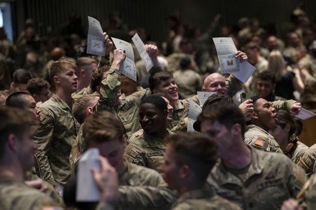 U.S. Military Academy cadets open envelopes during the Class of 2025 Branch Night, hosted by Defense Secretary Lloyd J. Austin III at the Ike Hall Theater at West Point, N.Y.