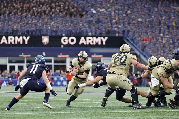 Army QB Bryson Daily runs against the Navy Midshipmen during the first quarter of an NCAA football game at Gillette Stadium on Saturday, Dec. 9, 2023, in Foxborough, Mass.