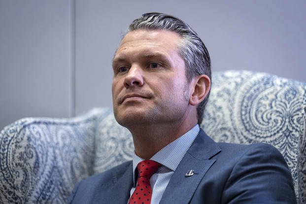 Pete Hegseth, President-elect Donald Trump's nominee to be defense secretary, responds to reporters during a meeting with Sen. Mike Rounds, R-S.D., a member of the Senate Armed Services Committee, at the Capitol in Washington, Thursday, Dec. 5, 2024.