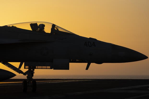 A fighter jet maneuvers on the deck of the USS Dwight D. Eisenhower in the Red Sea.