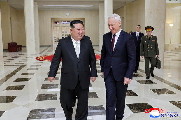 North Korean leader Kim Jong Un, left, meets Russian Defense Minister Andrei Belousov