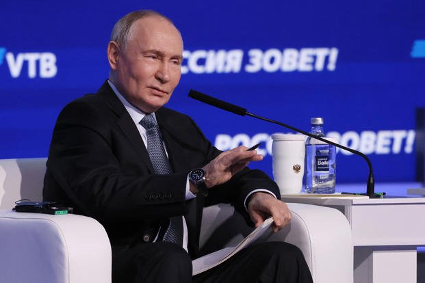 Russian President Vladimir Putin speaks during a plenary session of the VTB Investment Forum 'Russia Calling'