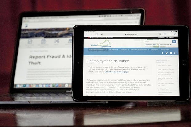 Web pages used to show information for collecting unemployment insurance in Virginia, right, and reporting fraud and identity theft in Pennsylvania, are displayed on the respective state web pages, on Feb. 26, 2021, in Zelienople, Pa. 