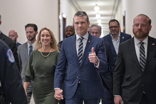  Pete Hegseth, President-elect Donald Trump's nominee to be Defense Secretary, gives a thumbs-up