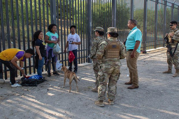 Texas Military Department soldiers guard the Texas-Mexico border