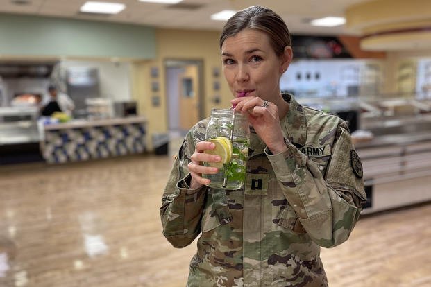 U.S. Army Capt. Caitlyn Shaver, chief of clinical nutrition at Blanchfield Army Community Hospital at Fort Campbell, Kentucky, drinks water throughout the day to help maintain optimal hydration. 