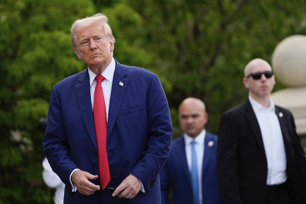 President Donald Trump walks after a news conference at Trump National Golf Club