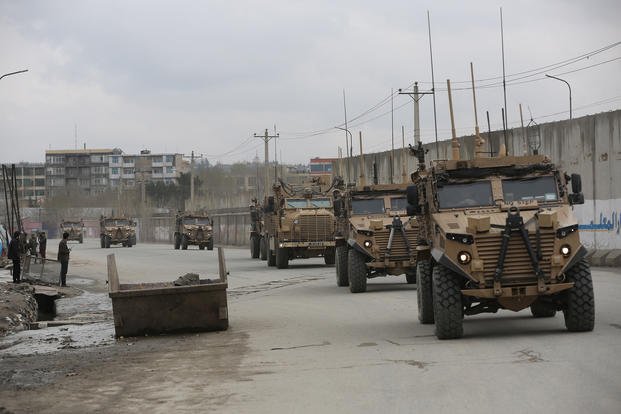 In this file photo dated March 25, 2020, British troops with NATO-led Resolute Support Mission forces travel through Kabul, Afghanistan. (AP Photo/Rahmat Gul)