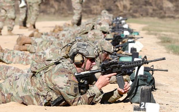 A Georgia National Guard Soldier assigned to the 48th Infantry Brigade Combat Team loads a magazine of ammunition into an M4 carbine rifle during weapons qualification November 19, 2022 in Fort Gordon, Ga. (Photo by Maj. Charles Emmons)