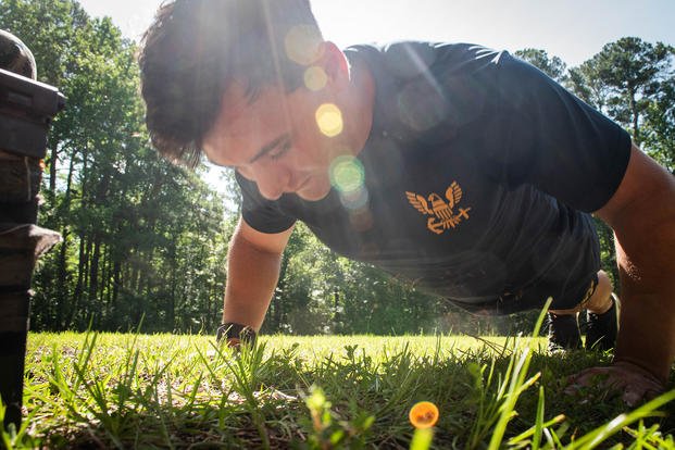Hospital Corpsman Third Class Dru Calloway conducts push-ups aboard Marine Corps Air Station Cherry Point, North Carolina.