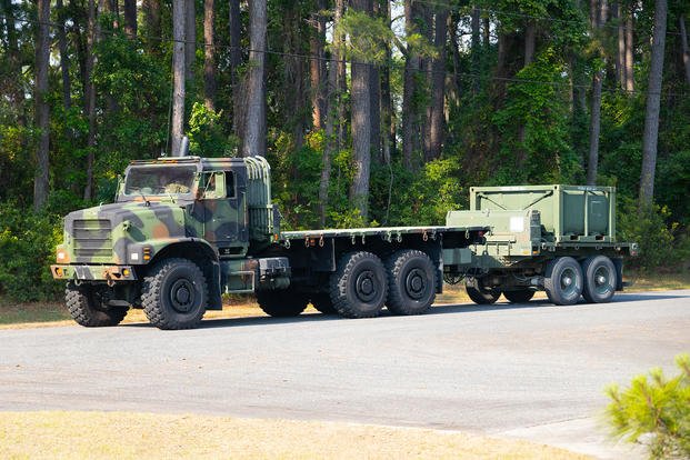 A U.S. Marine Corps 7-ton pulls fresh drinking water during Exercise STRATMOBEX at Marine Corps Air Station Beaufort.