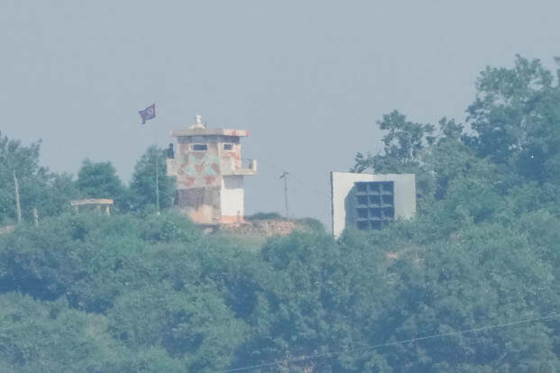 A North Korean military guard post, left, and loudspeaker are seen from Paju, South Korea