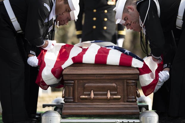 Sailors conduct military funeral honors in Section 69 of Arlington National Cemetery, Arlington, Virginia.