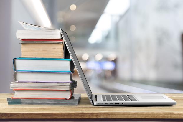 Textbooks and an open laptop