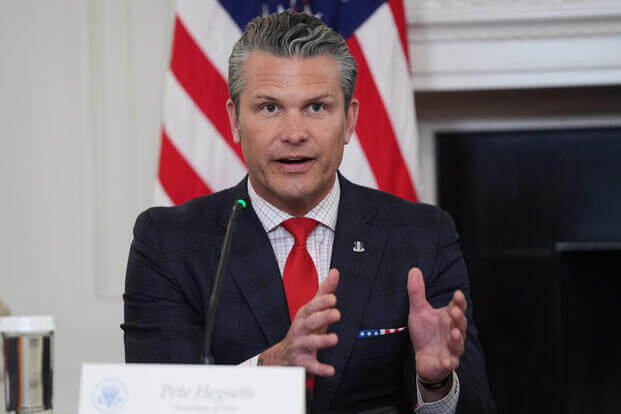 Defense Secretary Pete Hegseth answers a question from a reporter.