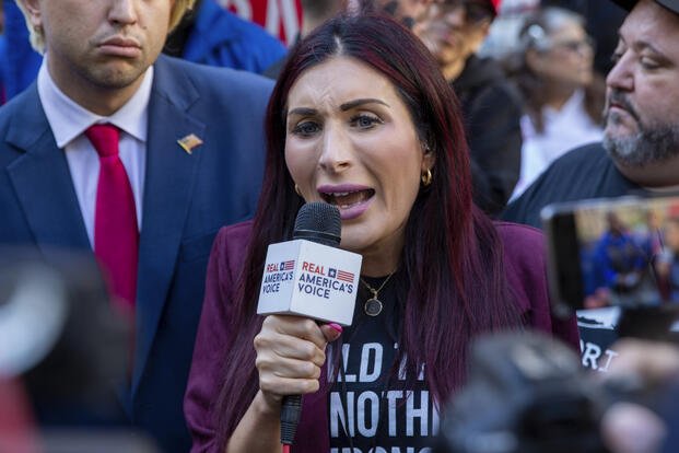 Right-wing activist Laura Loomer is in front of the courthouse where the hush-money trial of Donald Trump got underway Monday, April 15, 2024, in New York. (AP Photo/Ted Shaffrey)