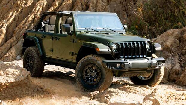 2023 Jeep Wrangler Willys Convertible In green Posing on rocky terrain