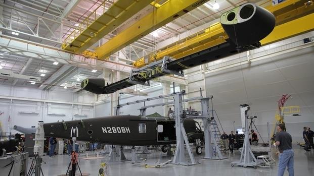 Bell Helicopter's wing is lowered to be attached to the fuselage of its V-280 Valor tilt-rotor helicopter in April 2016 at the company's aircraft assembly center in Amarillo, Texas. (Bell photo)