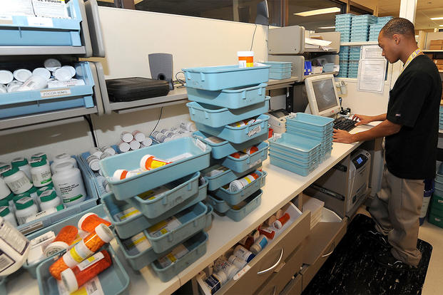 Mario Blount, pharmacy technician, verifies prescription labels at the David Grant USAF Medical center pharmacy. (Photo: U.S. Air Force/ Staff Sgt. Liliana Moreno)