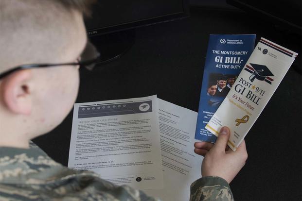 Airman Dalton Shank, 5th Bomb Wing Public Affairs broadcast journalist apprentice, reads pamphlets on the Montgomery GI Bill and the Post-9/11 GI Bill at Minot Air Force Base, N.D., March 10, 2017. (U.S. Air Force/Airman 1st Class Alyssa M. Akers)