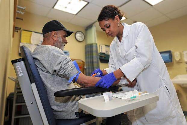 A veteran has his blood drawn for testing at a VA clinic. (image: va.gov)