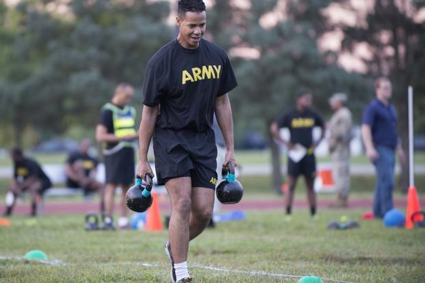 A Soldier carries two 40-pound kettlebell weights during a pilot for the Army Combat Readiness Test, a six-event assessment designed to reduce injuries and replace the current Army Physical Fitness Test (U.S. Army/Sean Kimmons)