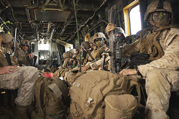 U.S. Marines move between landing zones during a CH-53E Super Stallion rotary-wing aircraft assault transport at Aibano Training Area during Forest Light 16-1. (U.S. Marine Corps/Lance Cpl. Mandaline Hatch)