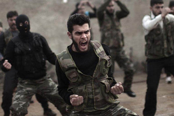 In this Dec. 17, 2012, file photo, Syrian rebels attend a training session in Maaret Ikhwan near Idlib, Syria. (AP Photo/Muhammed Muheisen, File)