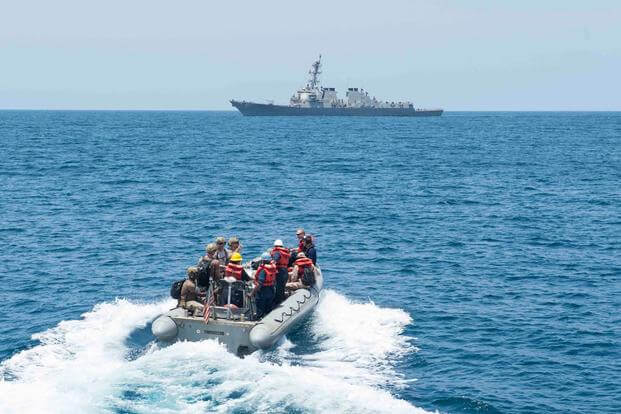 Sailors assigned to the guided-missile destroyer USS Farragut (DDG 99) conduct a passenger transfer with the guided-missile destroyer USS Winston S. Churchill (DDG 81). (U.S. Navy photo by Mass Communication Specialist 3rd Class Jackie Hart)