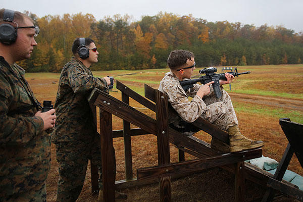 A Marine shoots an M4 carbine down range on a simulated rooftop during the 2015 Combat Shooting Match on Marine Corps Base Quantico, Oct. 26-30. (U.S. Marine Corps/Cpl. Kathy Nunez)