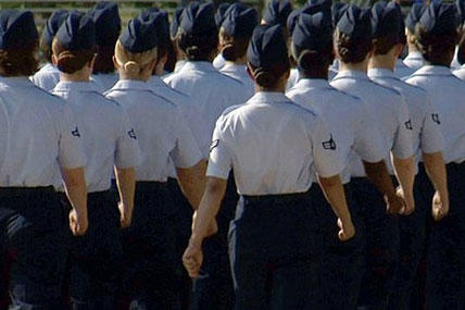 In this June 22, 2012, image made from video, female airmen march during graduation at Lackland Air Force Base in San Antonio.