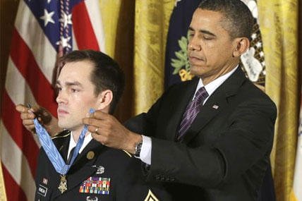President Barack Obama bestows the Medal of Honor on retired Staff Sgt. Clinton Romesha for conspicuous gallantry, Monday, Feb. 11, 2013.