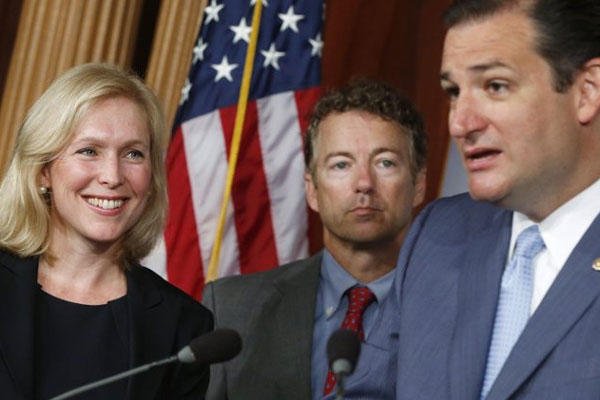 Sen. Kirsten Gillibrand, D-N.Y., left, smiles as she listens to Sen. Ted Cruz, R-Texas speak to reporters during a news conference about a bill regarding military sexual assault cases on Capitol Hill in Washington, Tuesday, July 16, 2013.