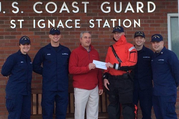 CG Station St. Ignace, Mich., and CG Chief Petty Officers Association partnered with the Kiwanis Club to make a donation Dec. 4, 2015, to provide meals to local families in need during the holiday season. (Photo: Senior Chief Petty Officer Mike Beatty)