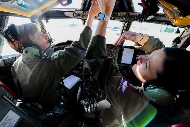 Col. Kristin Goodwin, the 2nd Bomb Wing commander, and Maj. Heather Decker, a 93rd Bomb Squadron instructor pilot, go through their preflight checklist prior to takeoff at Barksdale Air Force Base, La. (U.S. Air Force/2nd Lt. Jessica Adams)