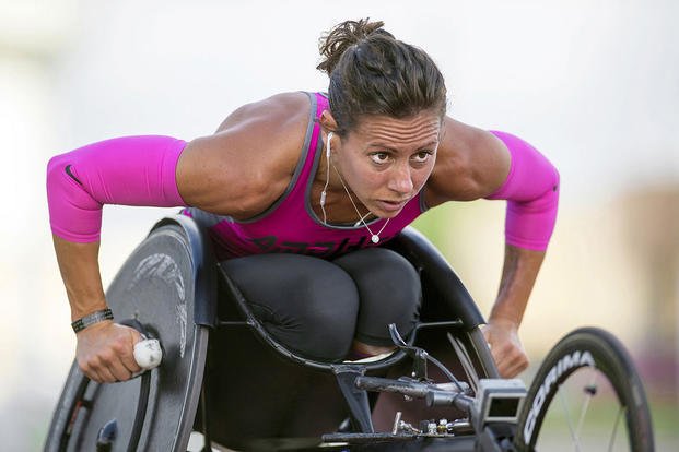 Army Capt. Kelly Elmlinger performs laps in her race wheelchair at Joint Base San Antonio, Texas, while training for the 2015 Department of Defense Warrior Games, June 11, 2015. (DoD photo by EJ Hersom)