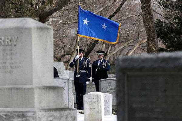 Joint Base McGuire-Dix-Lakehurst Honor Guard members Len Werner, left, and Jared Lacovara stand during a burial service at the West Point Cemetery on Friday, March 22, 2013, in West Point, N.Y.