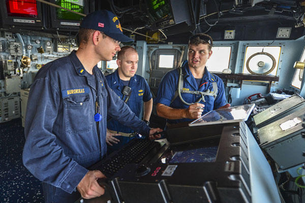 Ensigns Steven McGhan, right, and Phillip Gauronskas, left, conduct officer of the deck training while Lt. j.g. Timothy Davey, navigator of the guided-missile cruiser USS Monterey, observes. Navy photo by Mass Communication Specialist 3rd Class Billy Ho