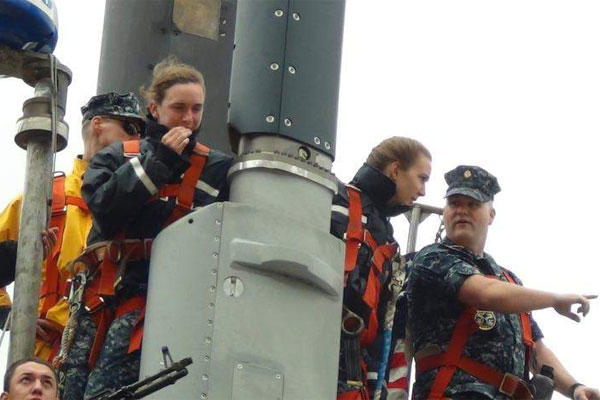 Sailors train two female midshipmen who in June 2012 were conducting their summer cruise aboard the Ohio-class guided-missile submarine Michigan. (Lt. Lara Bollinger / Navy)