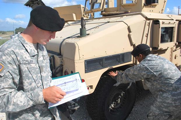 Soldiers from the 1st Cavalry Division at Fort Hood, Texas, conduct preventive maintenance checks & services as part of PDTE. (Jon Connor/U.S. Army)