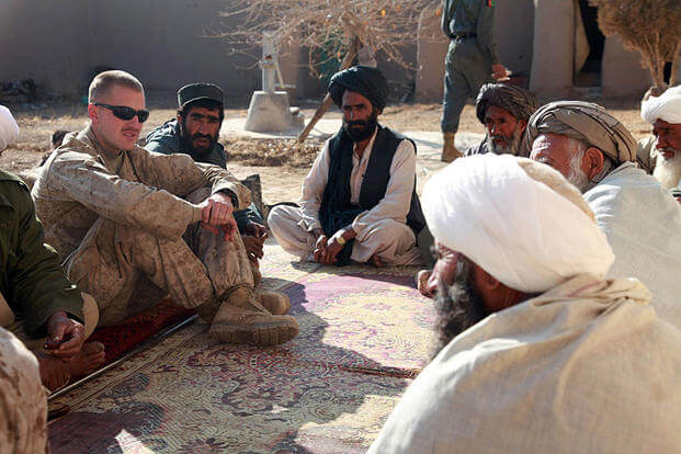 In this 2009 file photo, former Marine Corps Capt. Jason C. Brezler meets with Afghan leaders in Now Zad, Afghanistan. Albert F. Hunt/Marine Corps