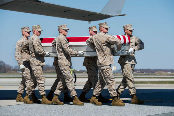 The remains of Marine Corps Staff Sgt. Louis F. Cardin of Temecula, Calif., arrive at Dover Air Force Base, Del., on March 21. (Air Force/Zachary Cacicia)