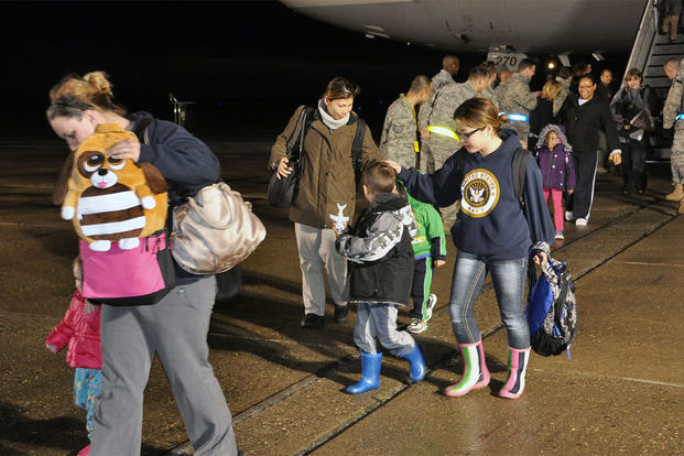 Military families arrive at Travis Air Force Base, California, on flight from Japan. Airman 1st Class Michael Battles/Air Force