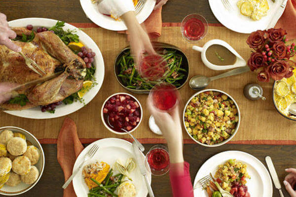 a table spread with food for a thanksgiving feast