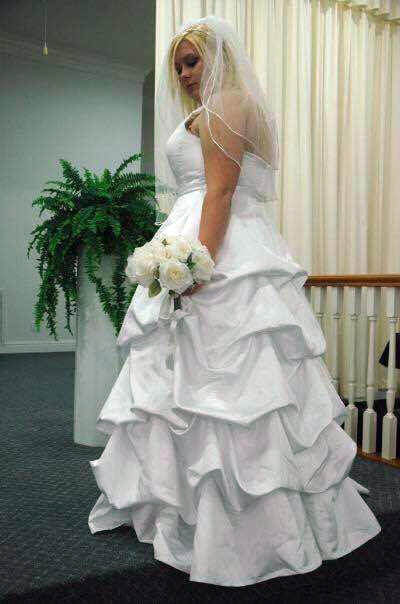 Justi Bates in her wedding gown. Instead of just keeping it in her closet, she she sent it off to be made into angel gowns for infants who don't make it out of the hospital. ((Photo courtesy of Justi Bates.)